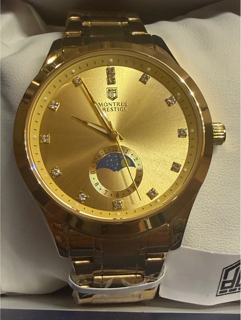 Montres Prestige gold-tone watch with moonphase dial